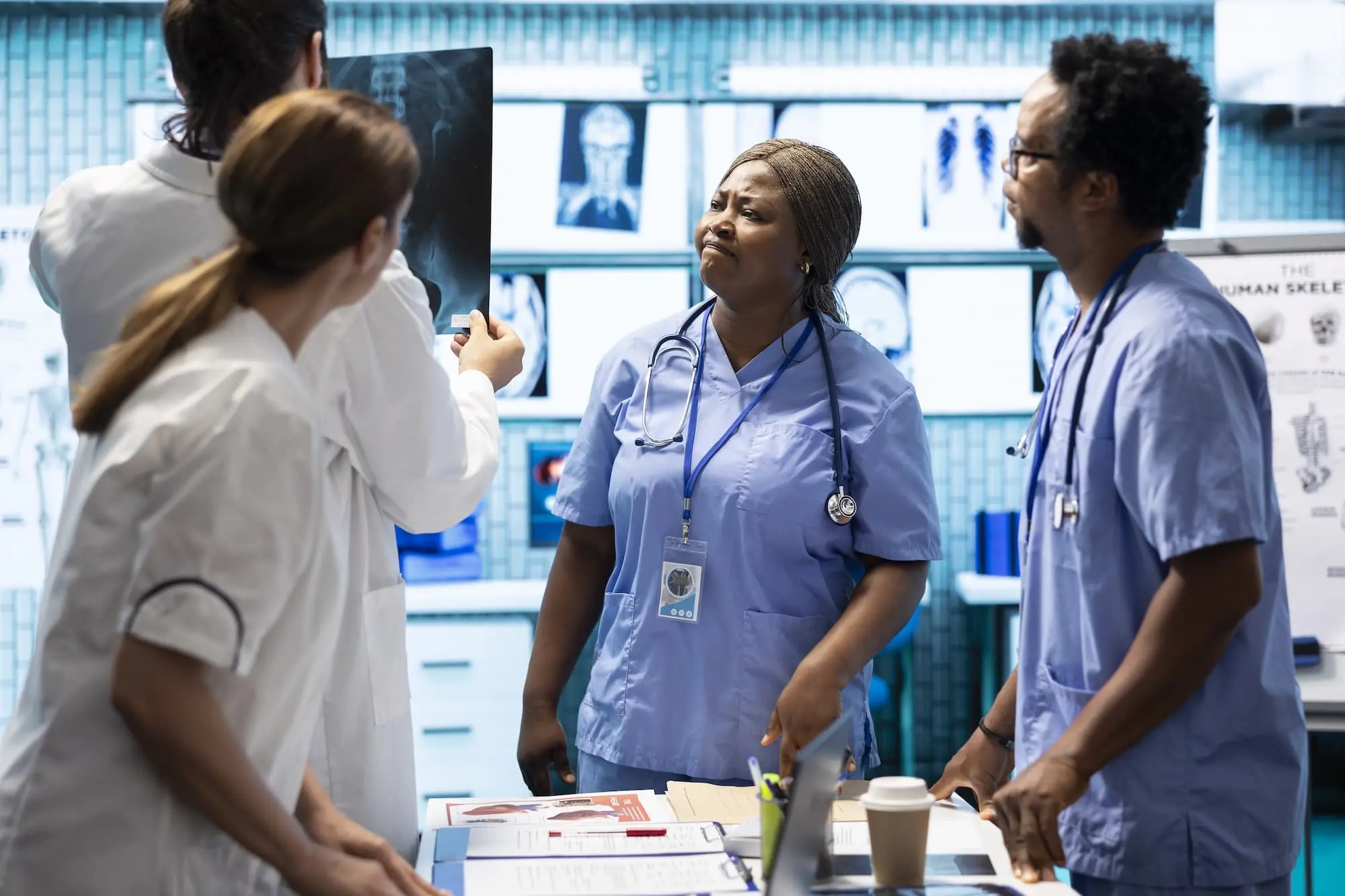 Group of medical professionals looking at an x-ray